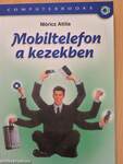 Mobiltelefon a kezekben