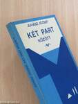 Két part között