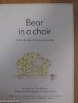 Bear in a chair