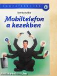 Mobiltelefon a kezekben