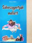 Sábeszgyertyák mellett