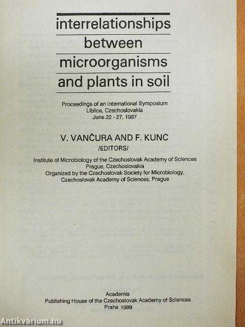 Interrelationships between microorganisms and plants in soil